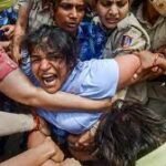 Wrestlers protest outside the New Parliament